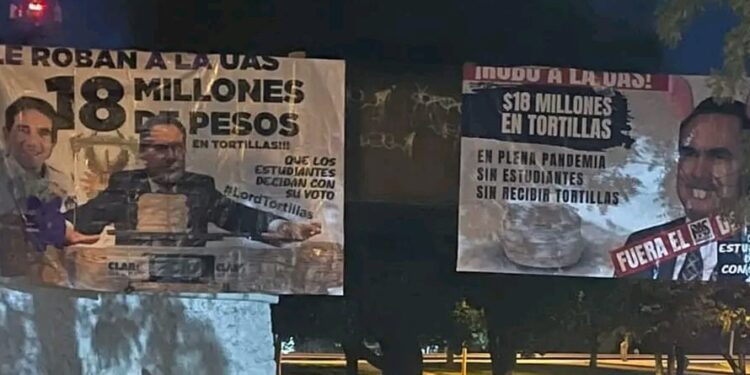 Colocan mantas para exigir salida de partido político de la UAS